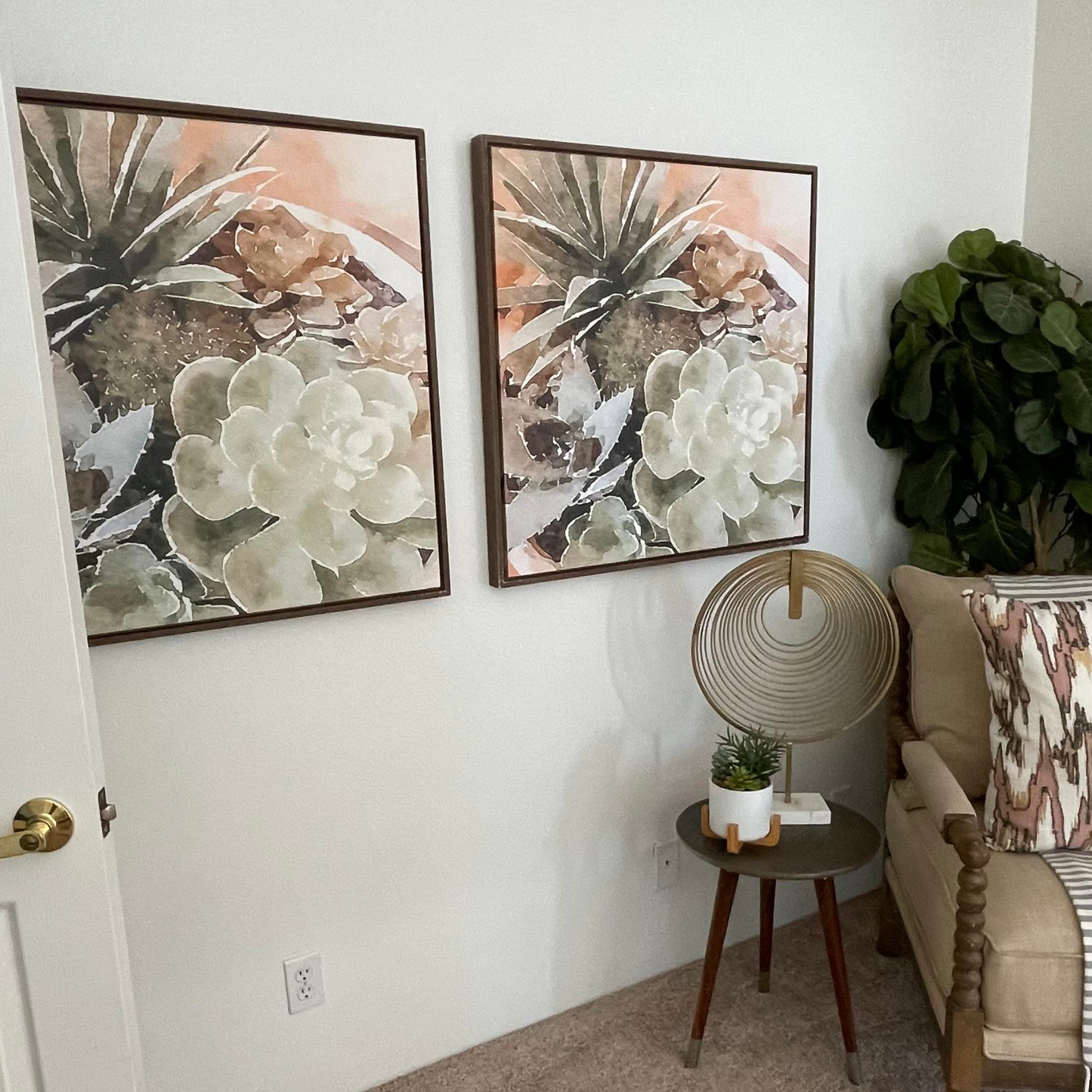 Succulent canvas on a wall in a staged bedroom