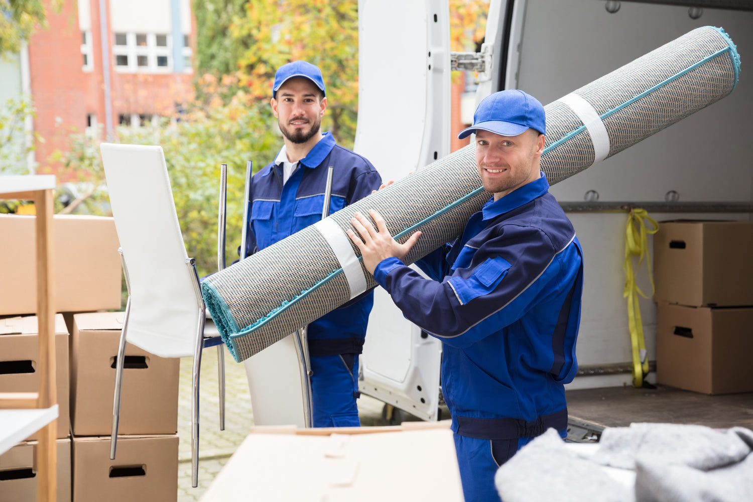 Staging delivery and setup - men carrying rug