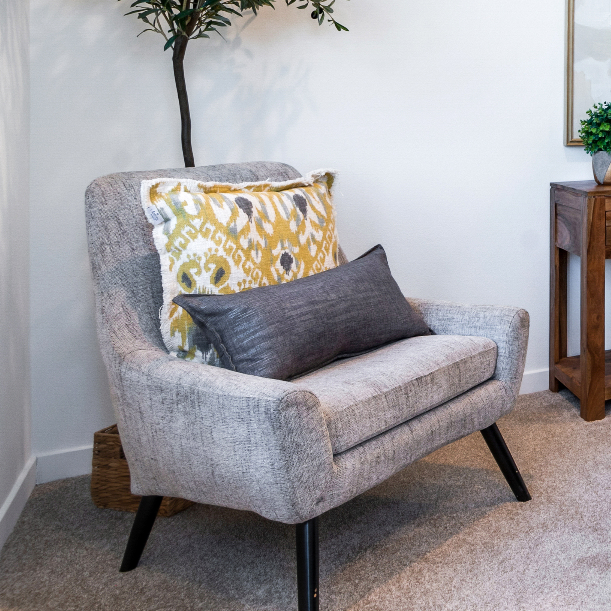 Grey Modern Accent Chair in a staged bedroom 
