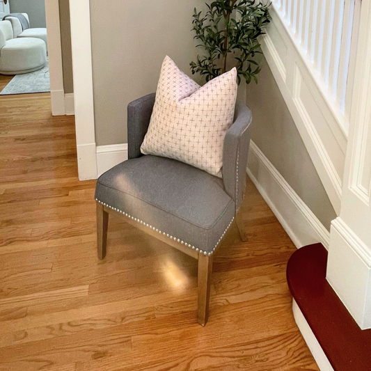 Grey Nailhead Accent Chair in a staged home