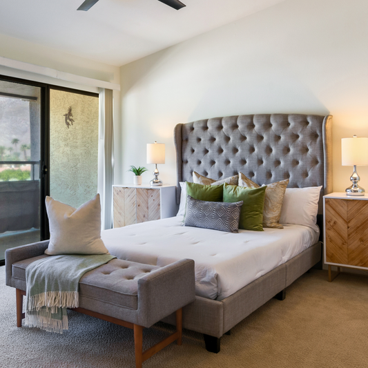 Grey Tufted Queen Bed Frame in a staged bedroom