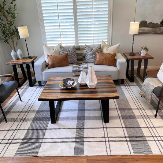 Raw Edge Coffee Table with metal legs in staged living room