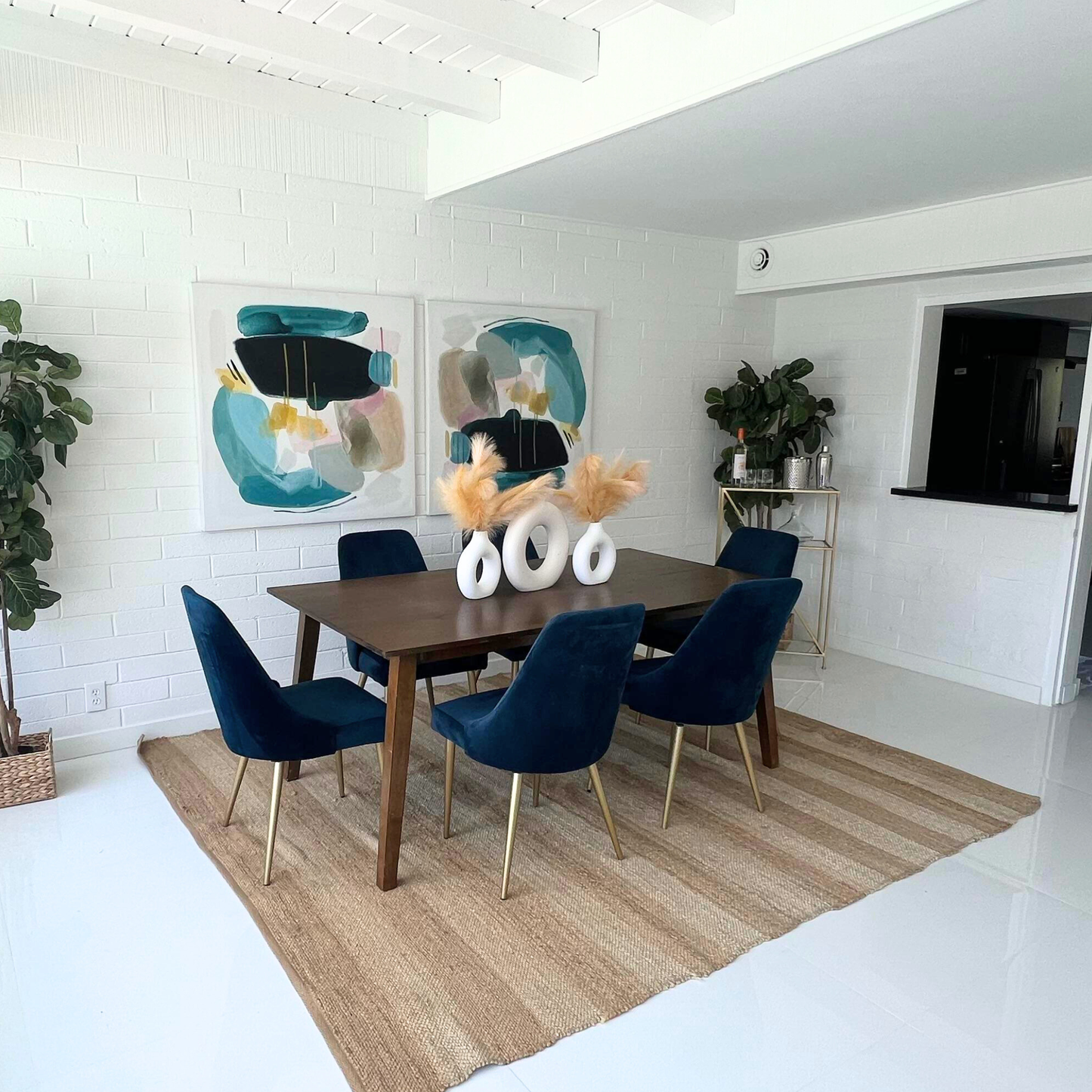 blue velvet dining chairs in a staged dining area
