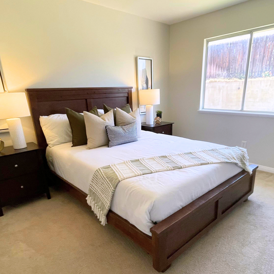 Wood Queen Bed Frame in a staged bedroom