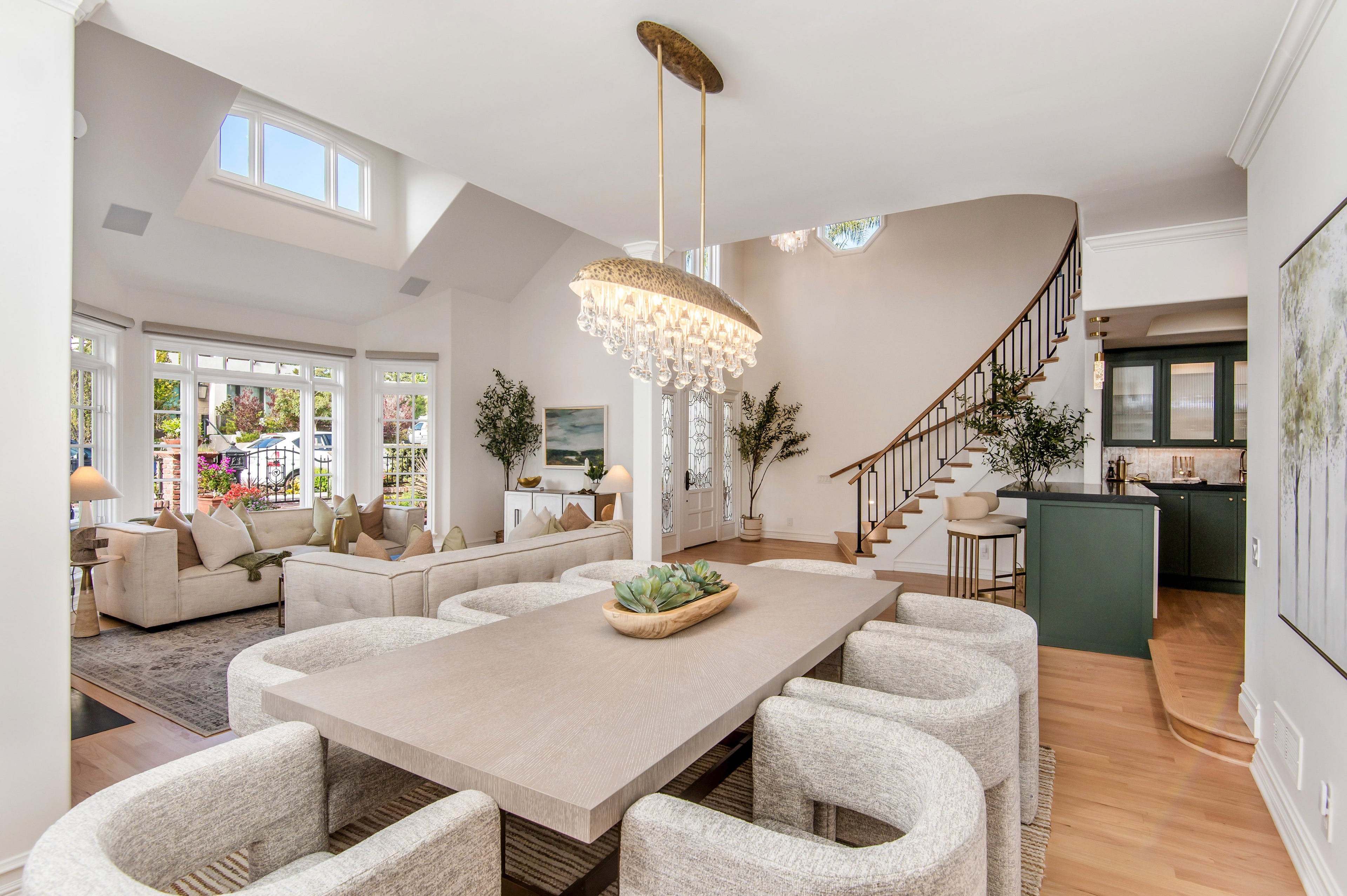 Modern living room with a dining table and chairs, staircase, and large windows.
DetailsProfessionally staged living room in Southern California home designed to attract buyers and support a successful home sale